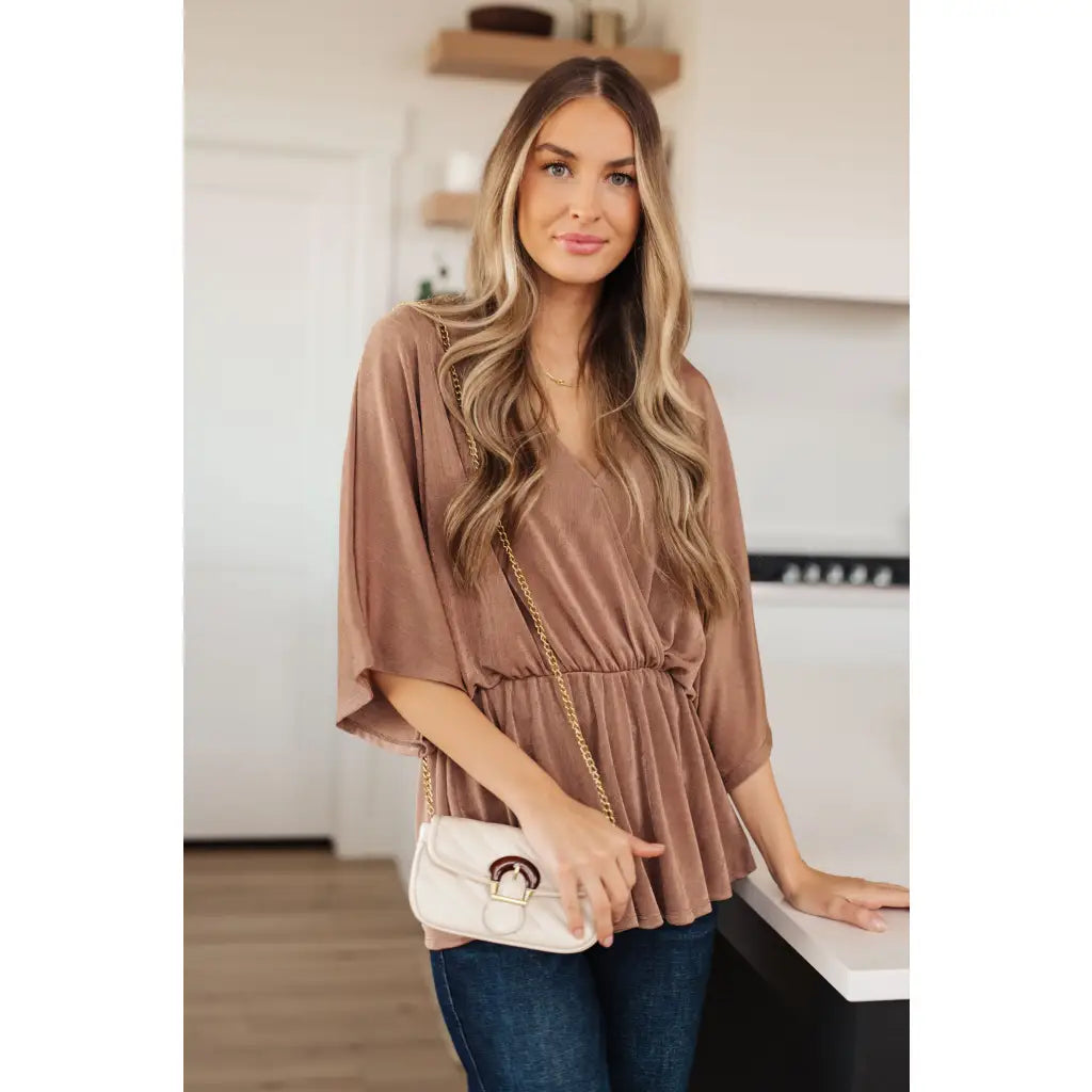 Meet our Bronzed Daze Draped V Neck Blouse! This gorgeous top is constructed from a slinky and shimmering bronze ribbed