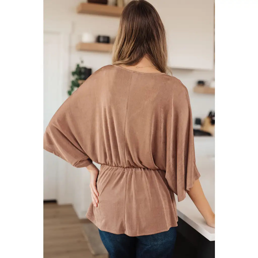 Meet our Bronzed Daze Draped V Neck Blouse! This gorgeous top is constructed from a slinky and shimmering bronze ribbed