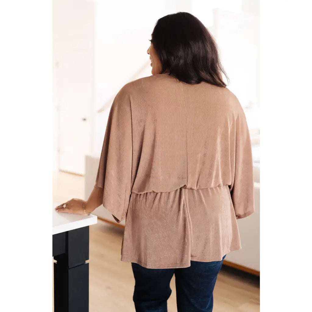Meet our Bronzed Daze Draped V Neck Blouse! This gorgeous top is constructed from a slinky and shimmering bronze ribbed
