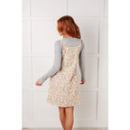 Floral button-up jumper dress in buttery corduroy. Lightweight adjustable and softly structured for all-day comfort