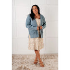 Floral button-up jumper dress in buttery corduroy. Lightweight adjustable and softly structured for all-day comfort