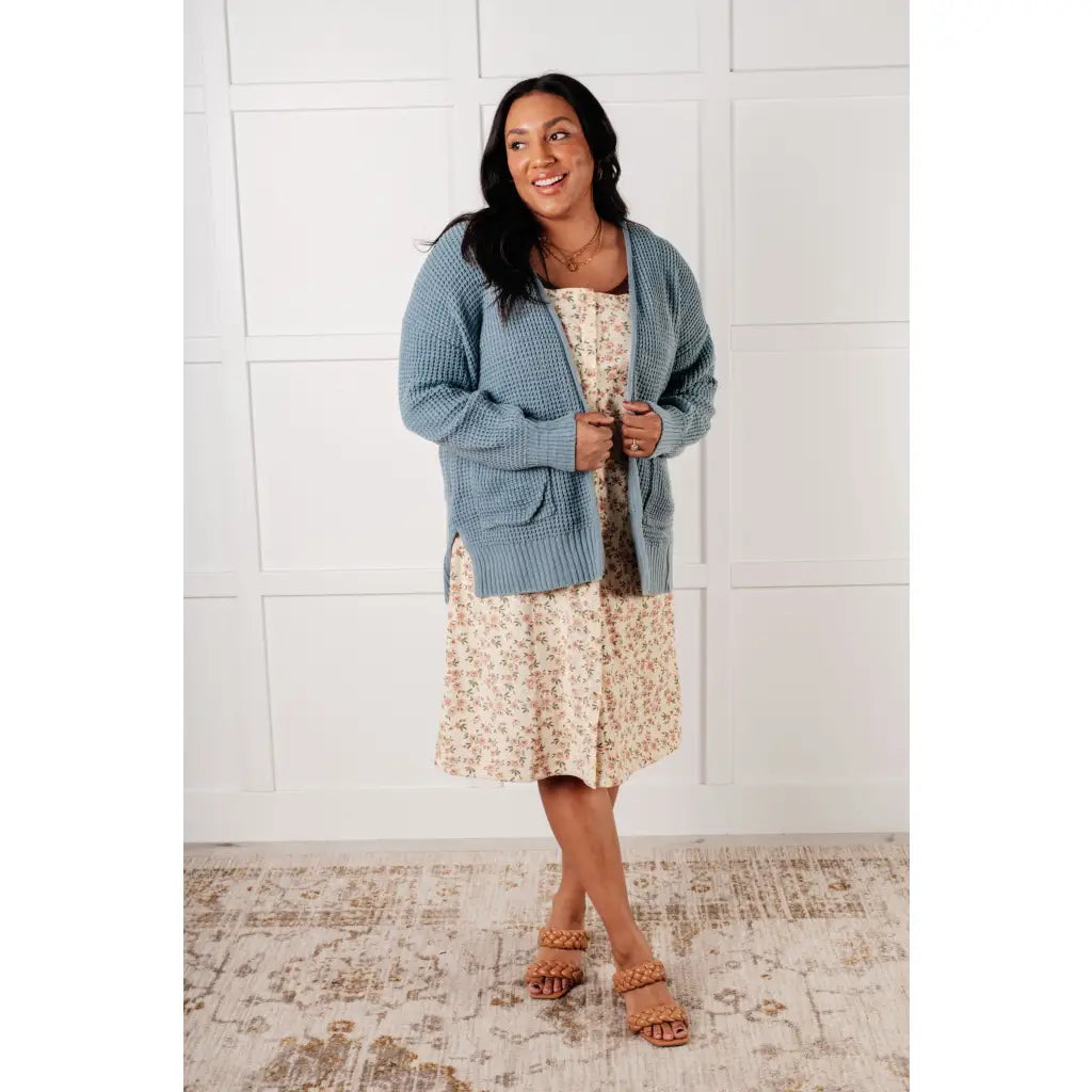 Floral button-up jumper dress in buttery corduroy. Lightweight adjustable and softly structured for all-day comfort