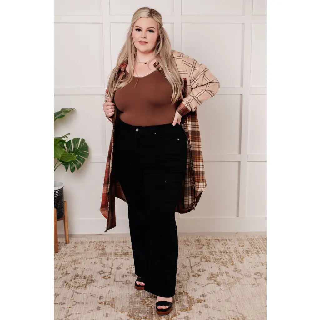 Gear up for cooler days with our Cabin Fever Flannel Plaid Long Shacket. The cozy soft and neutral toned flannel