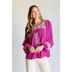 Magenta embroidered blouse with floral details. Flowy feminine and available in plus sizes for the perfect boutique fit.