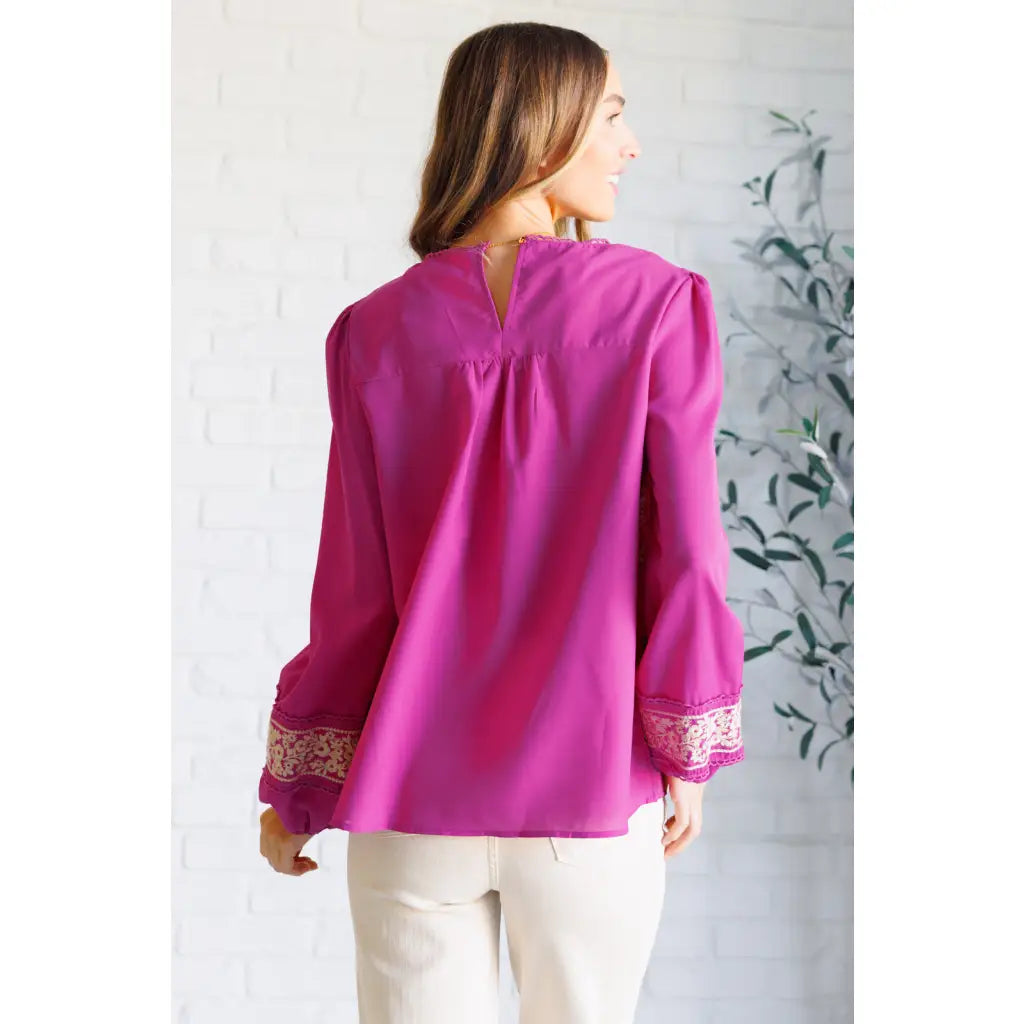 Magenta embroidered blouse with floral details. Flowy feminine and available in plus sizes for the perfect boutique fit.