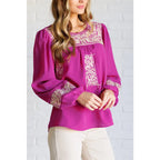 Magenta embroidered blouse with floral details. Flowy feminine and available in plus sizes for the perfect boutique fit.