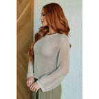 Our Calming Down Loose Knit Top in Beige offers lightweight comfort with its sheer layer and relaxed fit. Designed