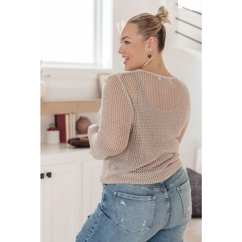 Our Calming Down Loose Knit Top in Beige offers lightweight comfort with its sheer layer and relaxed fit. Designed