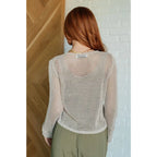 Our Calming Down Loose Knit Top in Beige offers lightweight comfort with its sheer layer and relaxed fit. Designed