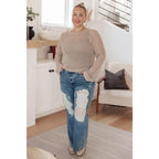 Our Calming Down Loose Knit Top in Beige offers lightweight comfort with its sheer layer and relaxed fit. Designed