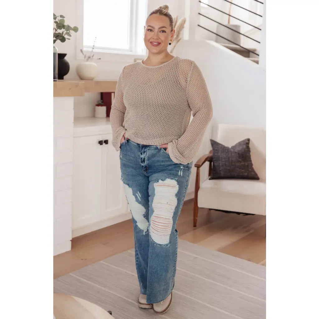 Our Calming Down Loose Knit Top in Beige offers lightweight comfort with its sheer layer and relaxed fit. Designed