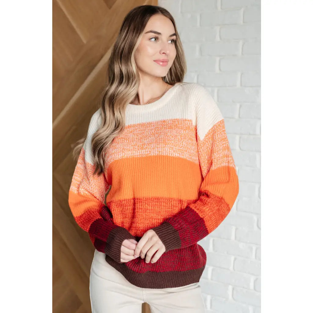 Our Candy Corn Color Block Wide Striped Sweater features a round neckline that adds touch of charm while the drop