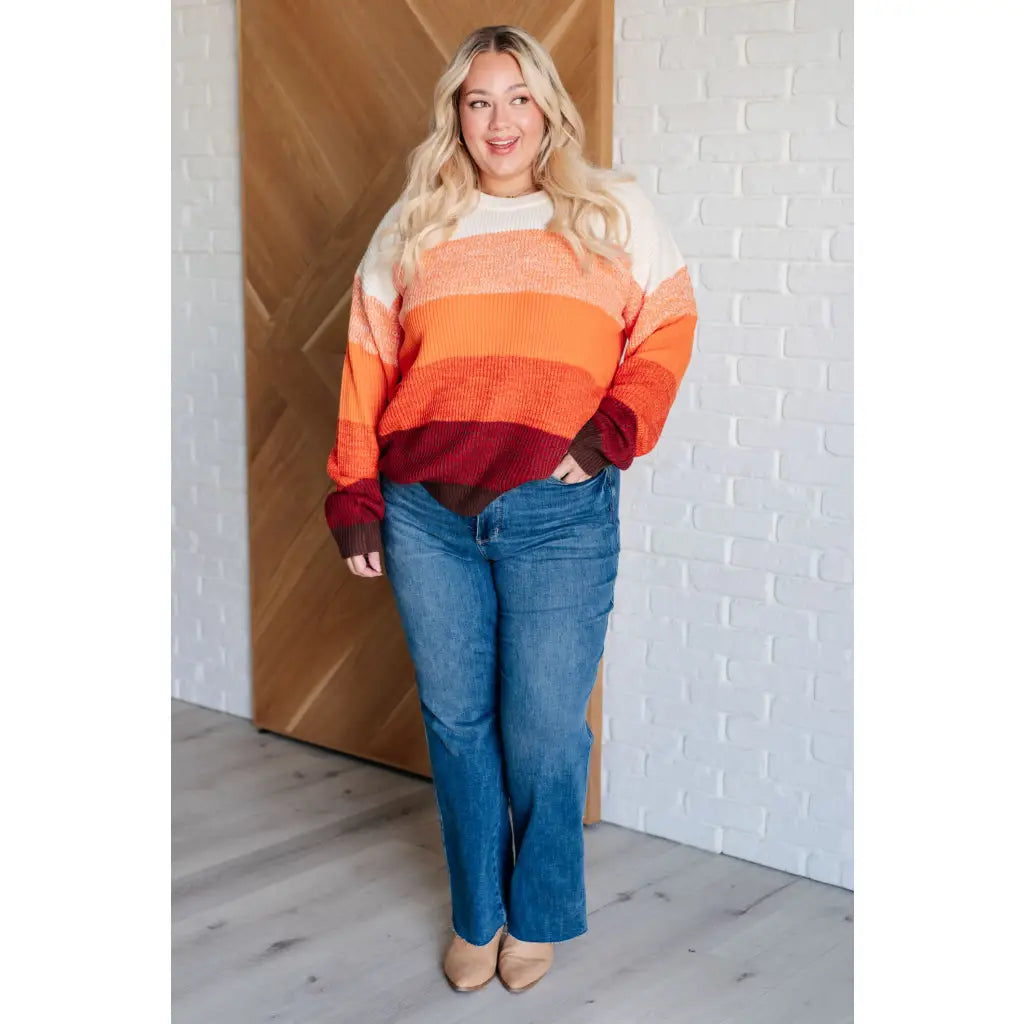 Our Candy Corn Color Block Wide Striped Sweater features a round neckline that adds touch of charm while the drop