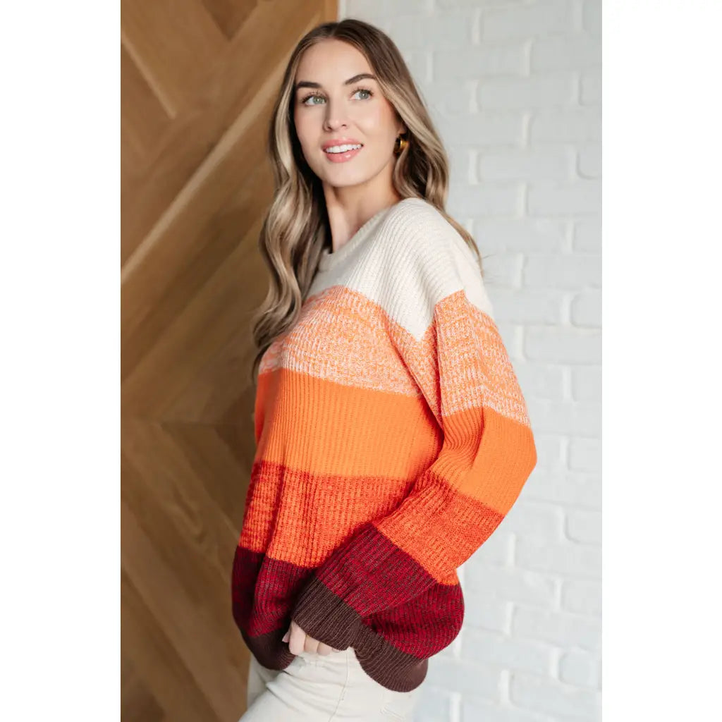 Our Candy Corn Color Block Wide Striped Sweater features a round neckline that adds touch of charm while the drop