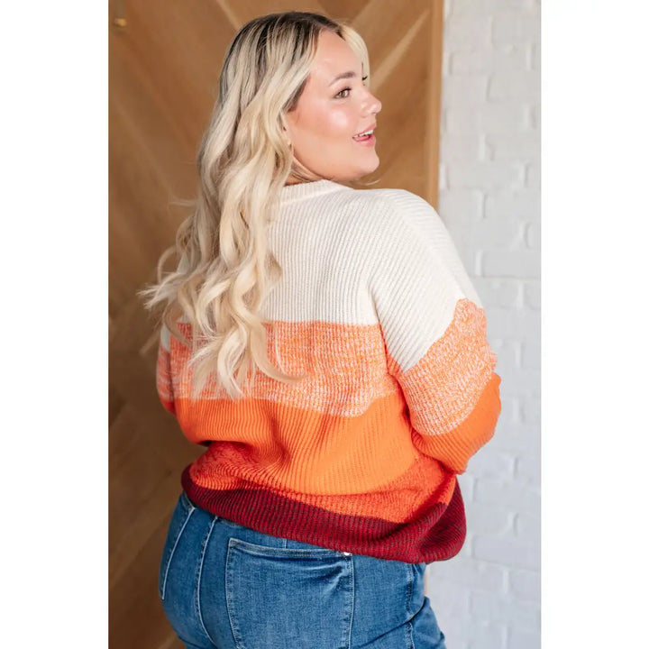 Our Candy Corn Color Block Wide Striped Sweater features a round neckline that adds touch of charm while the drop