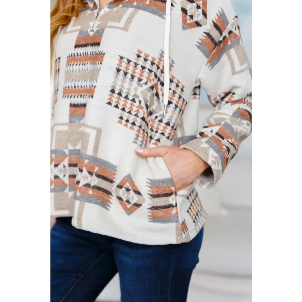 Our Caramel and Mocha Aztec Print Hoodie features a thick woven off-white brushed flannel with cozy print hooded 1/2