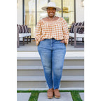 It’s easy to look cute and on trend in our Caramel Fall Gingham Plaid! This adorable top features an elasticated