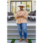 It’s easy to look cute and on trend in our Caramel Fall Gingham Plaid! This adorable top features an elasticated