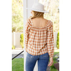 It’s easy to look cute and on trend in our Caramel Fall Gingham Plaid! This adorable top features an elasticated