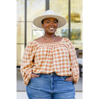 It’s easy to look cute and on trend in our Caramel Fall Gingham Plaid! This adorable top features an elasticated