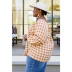 It’s easy to look cute and on trend in our Caramel Fall Gingham Plaid! This adorable top features an elasticated