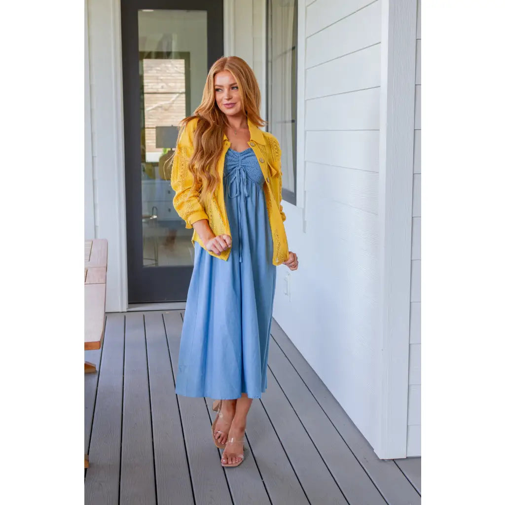 Feel the southern breeze in our Carolina My Mind Midi Dress! This lightweight denim dress features a smocked bust line