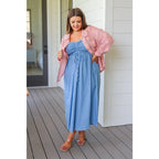 Feel the southern breeze in our Carolina My Mind Midi Dress! This lightweight denim dress features a smocked bust line