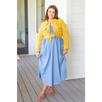 Feel the southern breeze in our Carolina My Mind Midi Dress! This lightweight denim dress features a smocked bust line