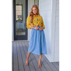 Feel the southern breeze in our Carolina My Mind Midi Dress! This lightweight denim dress features a smocked bust line