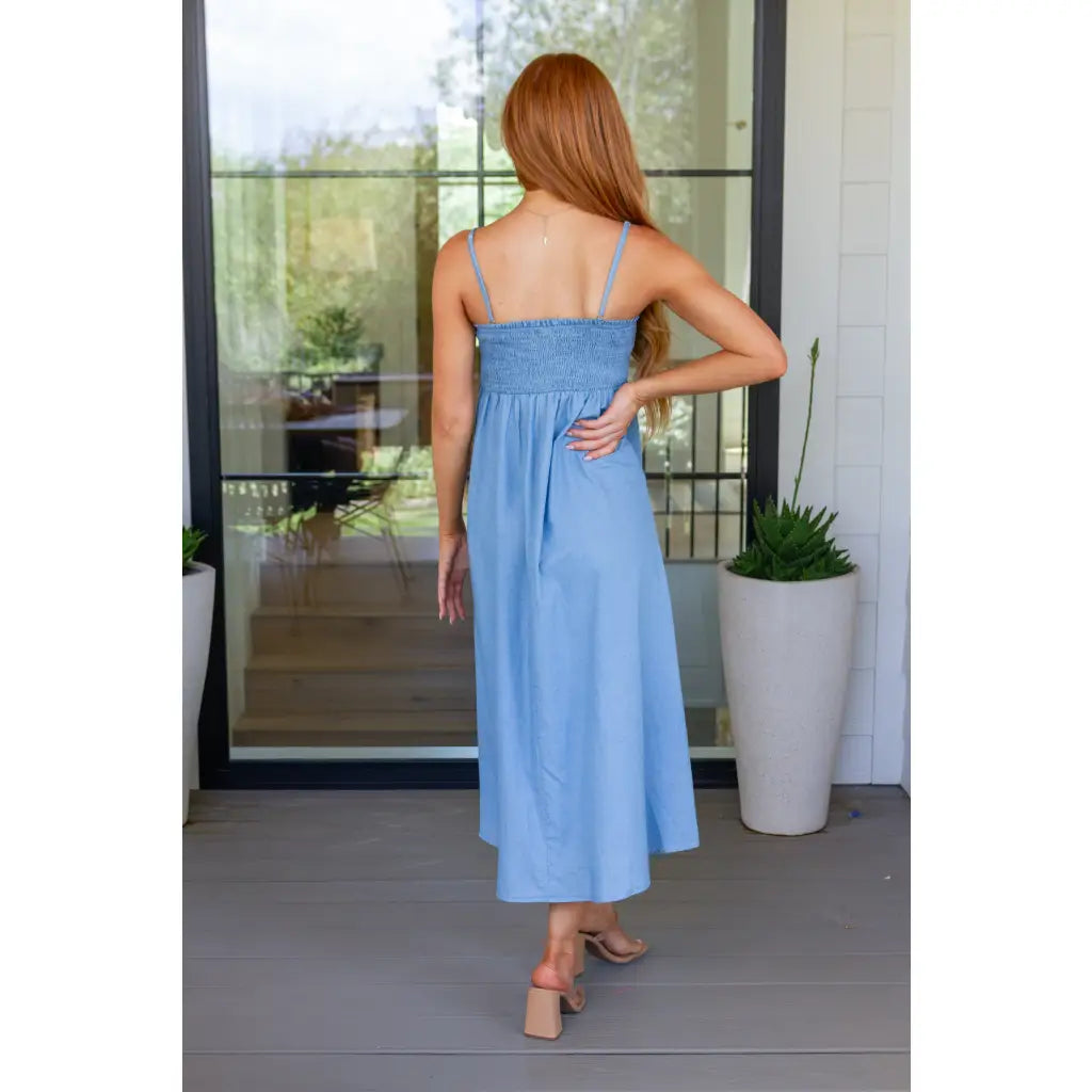 Feel the southern breeze in our Carolina My Mind Midi Dress! This lightweight denim dress features a smocked bust line