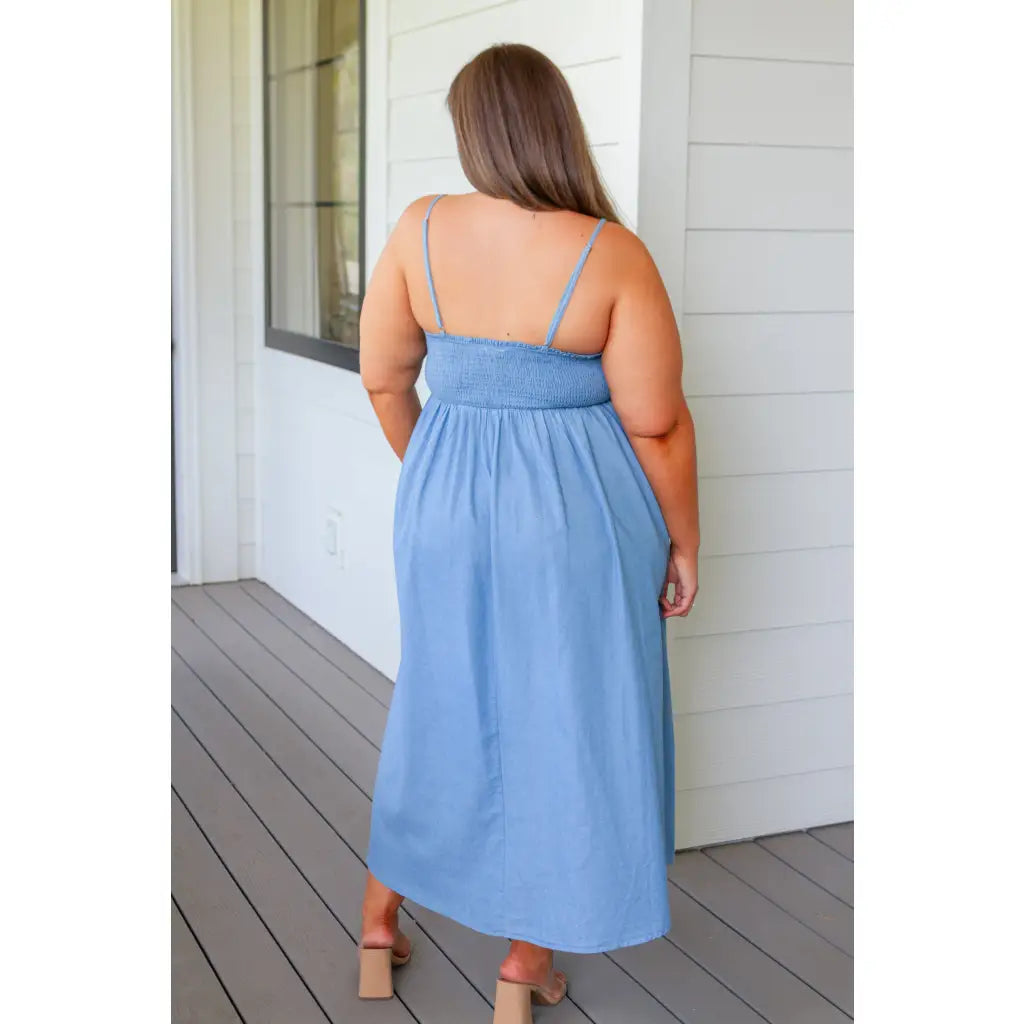 Feel the southern breeze in our Carolina My Mind Midi Dress! This lightweight denim dress features a smocked bust line