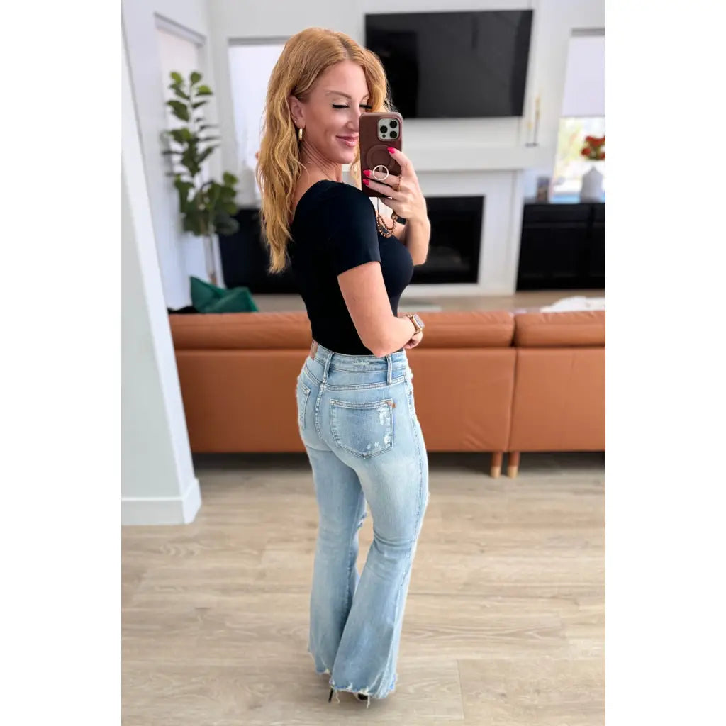 Our Caroline Mid Rise Tummy Control Flare Jeans are the perfect combination of style and comfort! With its tummy