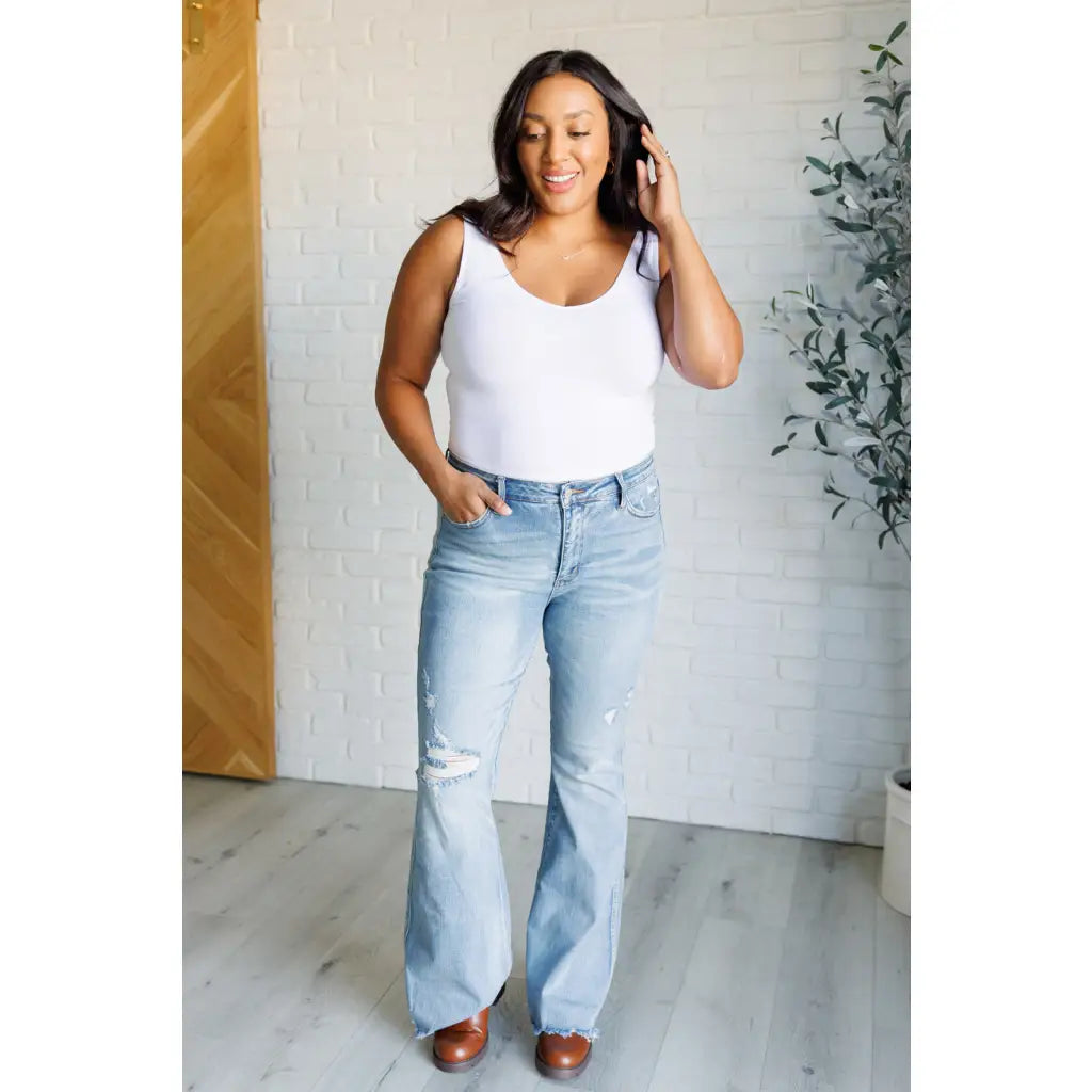 Our Caroline Mid Rise Tummy Control Flare Jeans are the perfect combination of style and comfort! With its tummy