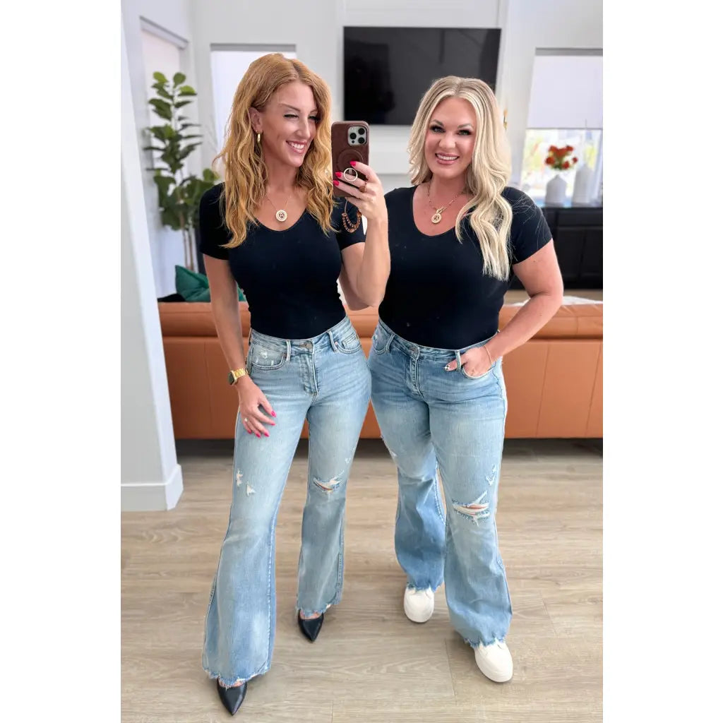 Our Caroline Mid Rise Tummy Control Flare Jeans are the perfect combination of style and comfort! With its tummy