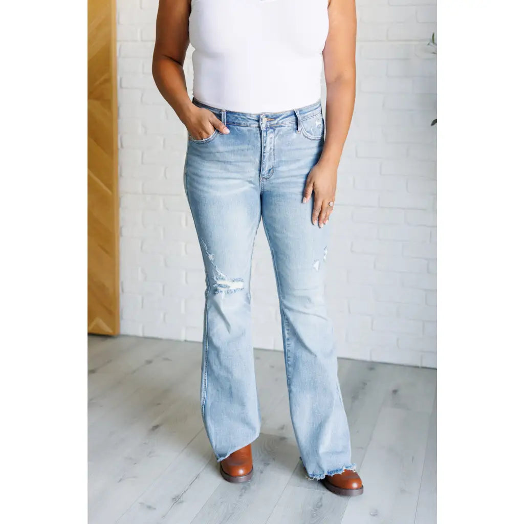 Our Caroline Mid Rise Tummy Control Flare Jeans are the perfect combination of style and comfort! With its tummy