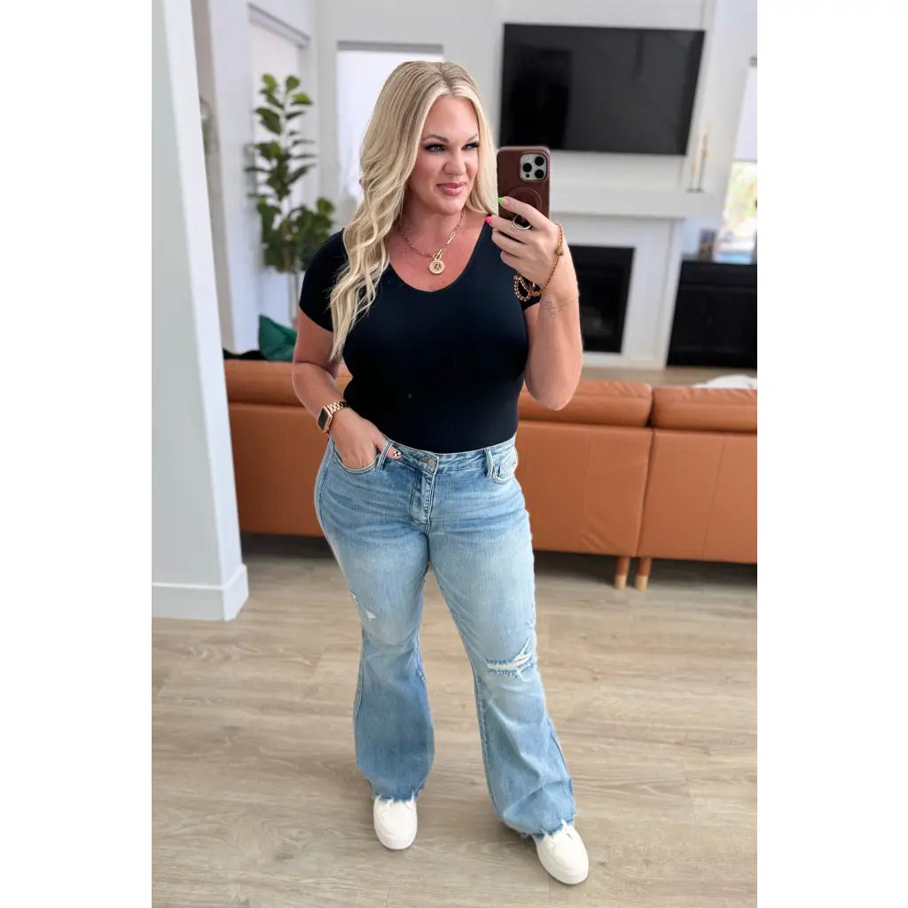 Our Caroline Mid Rise Tummy Control Flare Jeans are the perfect combination of style and comfort! With its tummy