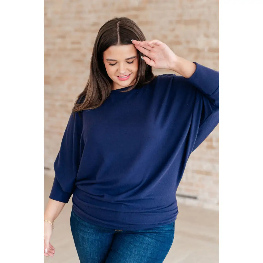 Stay cozy and chic with our Casually Comfy Batwing Top! Made soft brushed hacci navy fabric this boat neckline top