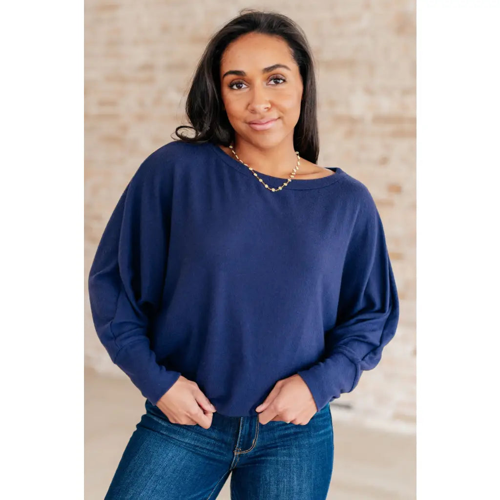 Stay cozy and chic with our Casually Comfy Batwing Top! Made soft brushed hacci navy fabric this boat neckline top