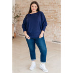 Stay cozy and chic with our Casually Comfy Batwing Top! Made soft brushed hacci navy fabric this boat neckline top