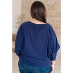 Stay cozy and chic with our Casually Comfy Batwing Top! Made soft brushed hacci navy fabric this boat neckline top