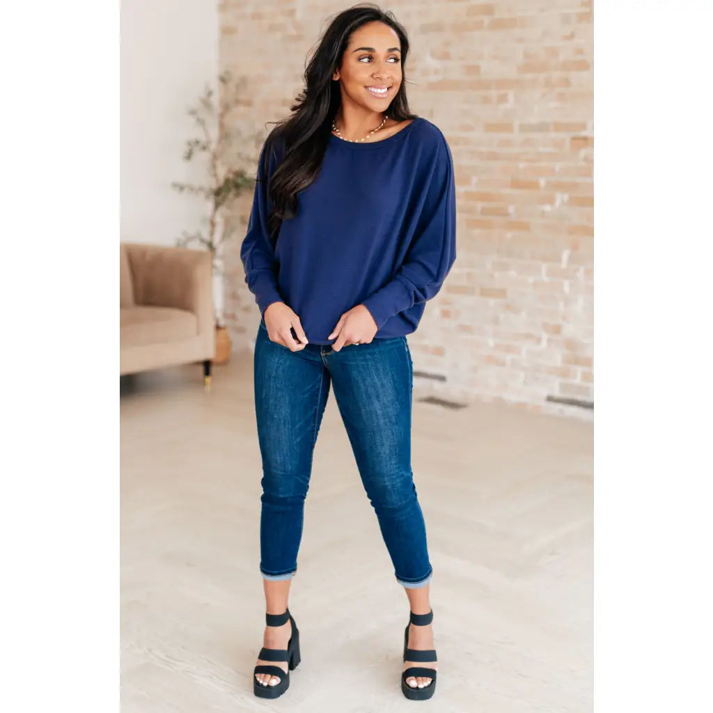 Stay cozy and chic with our Casually Comfy Batwing Top! Made soft brushed hacci navy fabric this boat neckline top