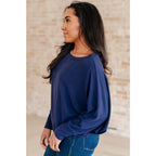 Stay cozy and chic with our Casually Comfy Batwing Top! Made soft brushed hacci navy fabric this boat neckline top