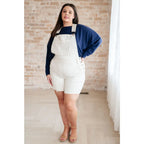 Stay cozy and chic with our Casually Comfy Batwing Top! Made soft brushed hacci navy fabric this boat neckline top