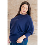 Stay cozy and chic with our Casually Comfy Batwing Top! Made soft brushed hacci navy fabric this boat neckline top