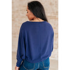 Stay cozy and chic with our Casually Comfy Batwing Top! Made soft brushed hacci navy fabric this boat neckline top