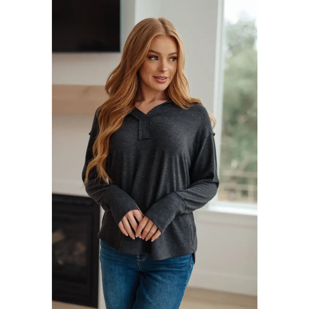 Cozy charcoal long sleeve top with thumb holes and v-neck. Relaxed fit available in plus sizes. Boutique comfy