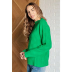 Green checkered boutique sweater with luxe knit and ribbed trim. Plus sizing available. Style it casual or chic.