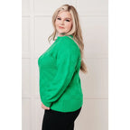 Green checkered boutique sweater with luxe knit and ribbed trim. Plus sizing available. Style it casual or chic.