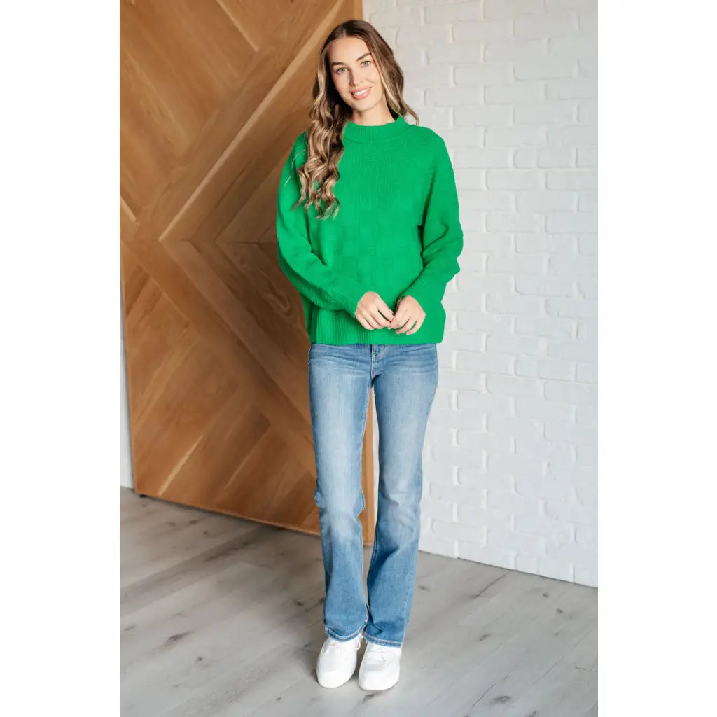 Green checkered boutique sweater with luxe knit and ribbed trim. Plus sizing available. Style it casual or chic.