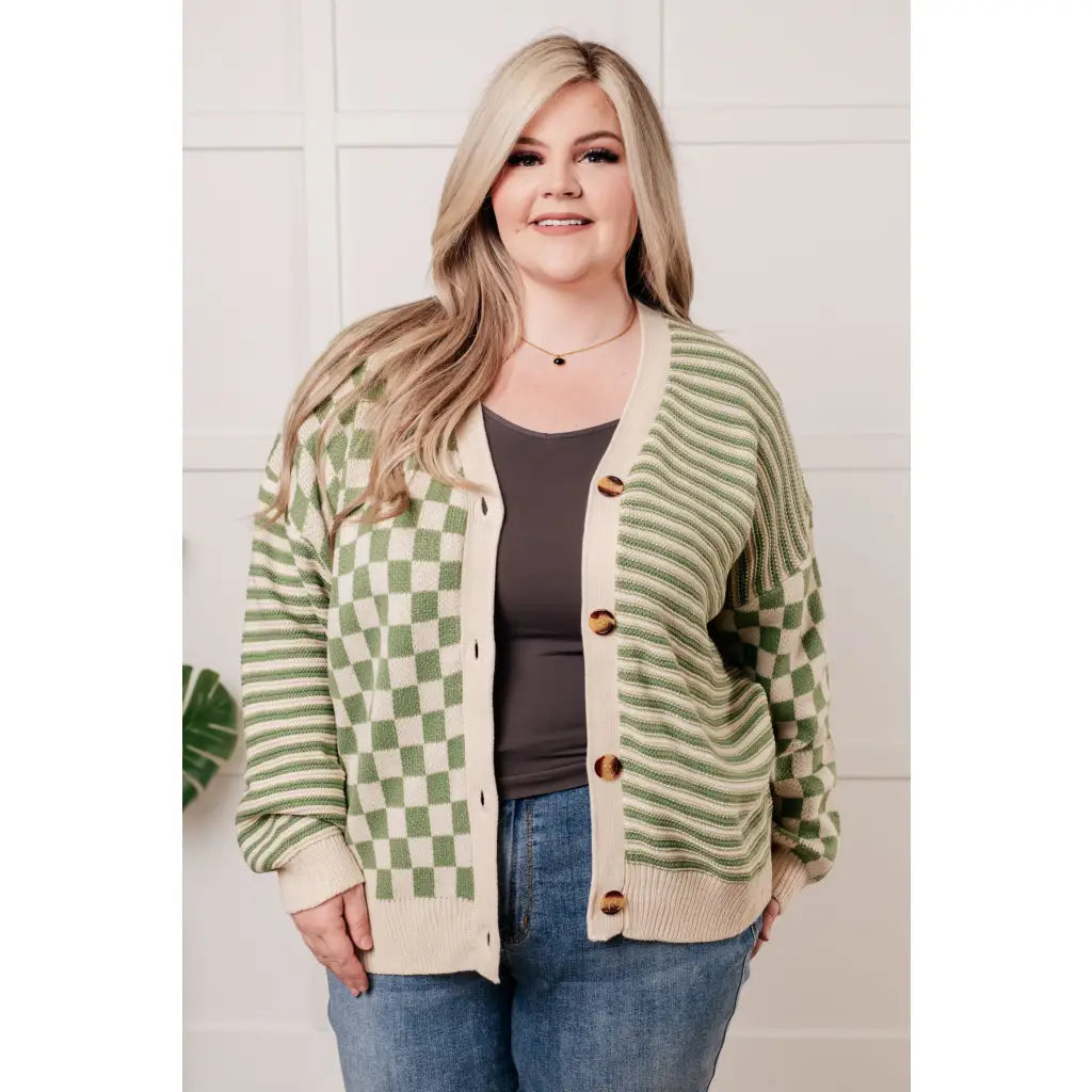 Stay cozy and stylish in our Check the Stripes Knit Cardigan Olive. This versatile piece features a flattering